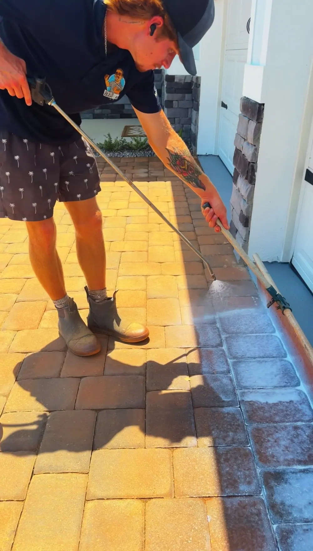 All Elite crew member working on a paver walkway